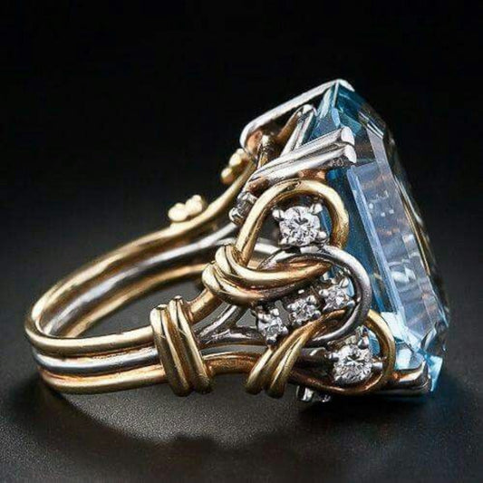 Geschichteter Goldring mit blauem Zirkonia