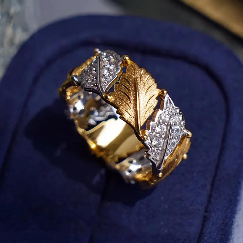 Goldring mit Zirkonia und goldenen Blättern